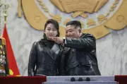 Kim Jong Un Vows Nuclear Arsenal Expansion at Military Parade with Daughter
