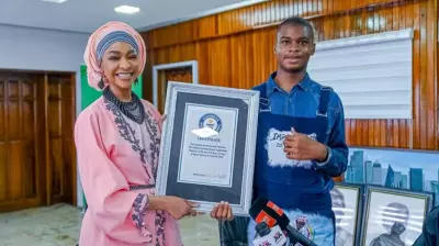 Autistic Teen Cyclist Presents Guinness World Record Certificate to Minister