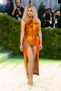 Kim Kardashian Turns Heads at 2026 Met Gala in Custom Orange Breastplate