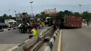 Driver, assistant flee after container truck falls near Oshodi flyover