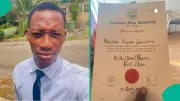 First-Class Physics Graduate Ibrahim Kefas Gyurison Proudly Shows Certificate