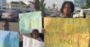 Mother, 3 children protest in Abuja over school kidnappings