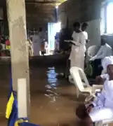 Church members defy flood, hold service in submerged Lagos church