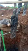 Construction workers uncover pin-covered figurine at building site