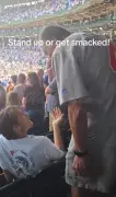 Older fan slaps younger man for sitting during national anthem at MLB game