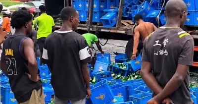 Nigerians rush to drink spilled beer after Lagos van crash